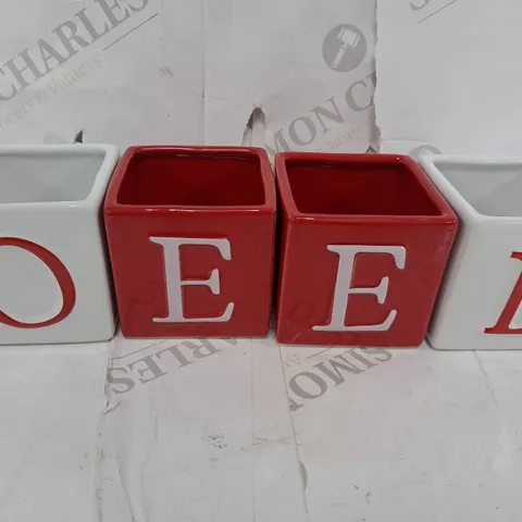 NOEL TEALIGHT CANDLE HOLDERS β SET OF 4