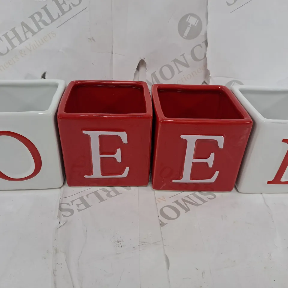 NOEL TEALIGHT CANDLE HOLDERS – SET OF 4 RRP £20