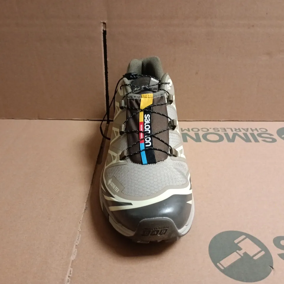 BOXED PAIR OF SALOMON TRAINERS IN LIGHT TAUPE SIZE UK 9.5