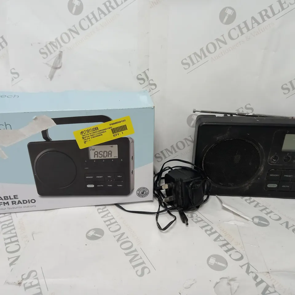 BOXED PORTABLE AM/FM RADIO IN BLACK