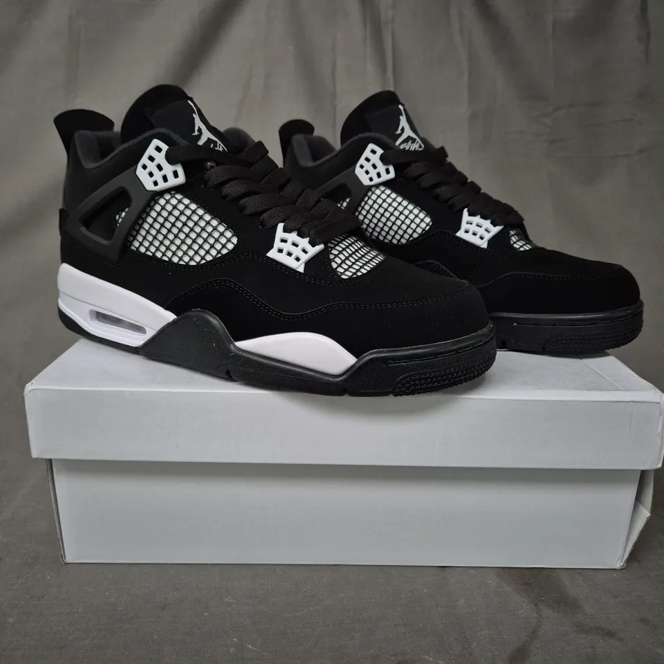 BOXED PAIR OF NIKE AIR JORDAN 4 RETRO SHOES IN BLACK/WHITE UK SIZE 9