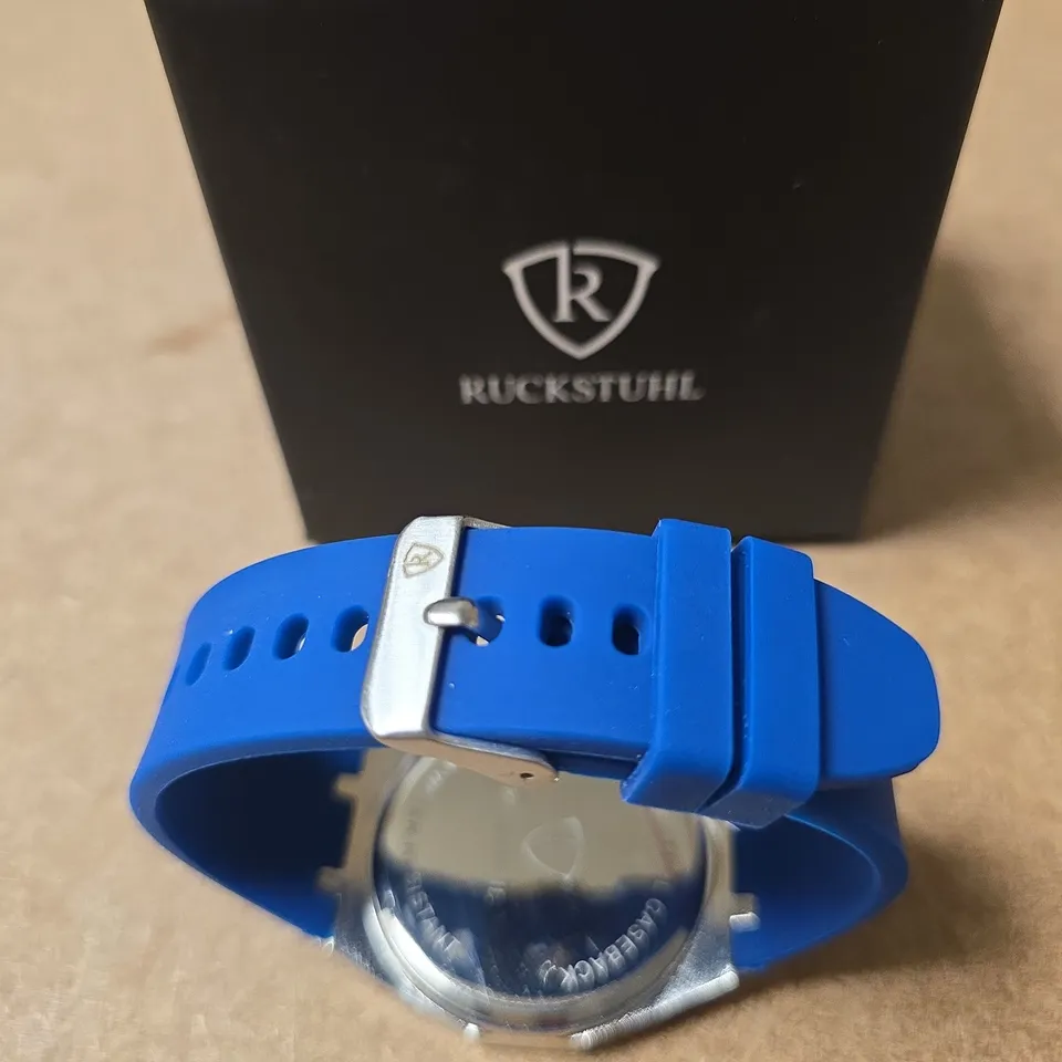 RUCKSTUHL WRISTWATCH WITH TWO TONE DIAL AND  BLUE SILICONE STRAP – BOXED