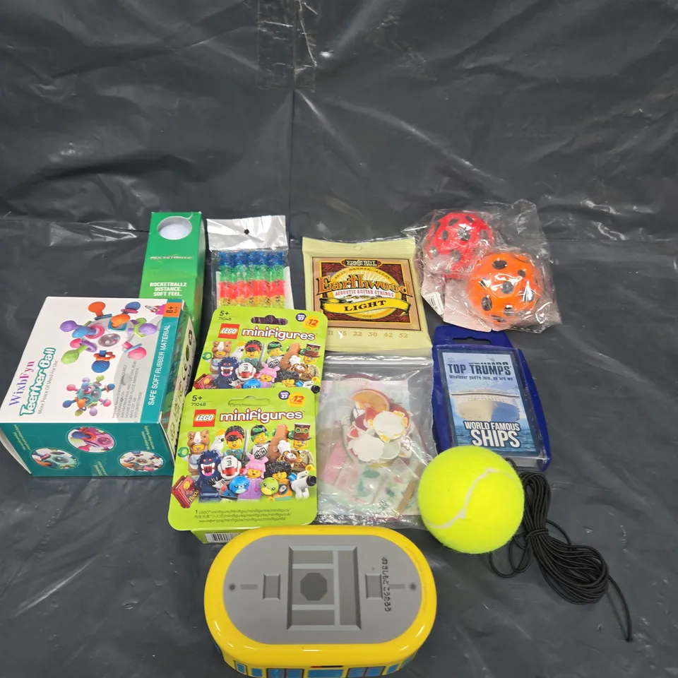 APPROXIMATELY 15 ASSORTED TOYS & GAMES TO INCLUDE GUITAR STRINGS, LEGO AND GOLF BALLS