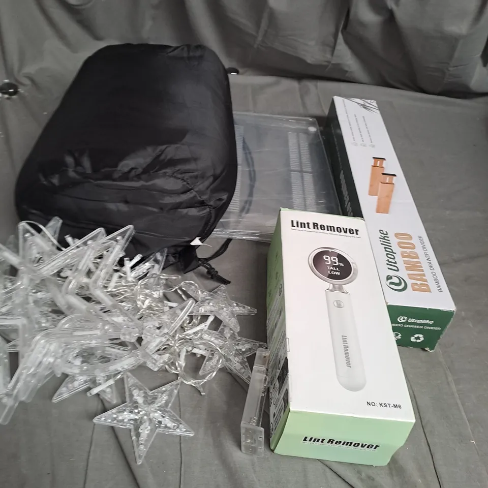 APPROXIMATELY 20 ASSORTED HOUSEHOLD ITEMS  TOO INCLUDE , LINT REMOVER , BAMBOO DRAWER DIVIDER , XMAS LIGHTS 