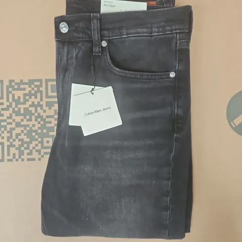 CALVIN KLEIN SLIM TAPER JEANS IN BLACK SIZE 32/32