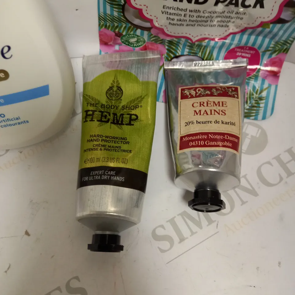 LOT OF APPROX 4 TO INCLUDE BABY DOVE LOTION , BODY POLISH , ETC