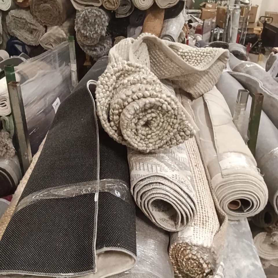 STILLAGE OF ASSORTED QUALITY RUGS APPROXIMATELY 27