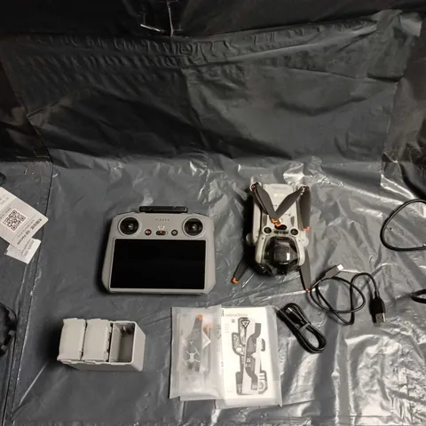 DJI Drone kit with integrated-screen controller, batteries & charger – carry case