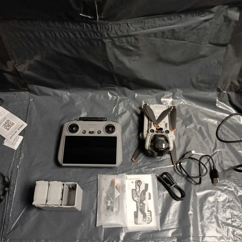 DJI Drone kit with integrated-screen controller, batteries & charger – carry case