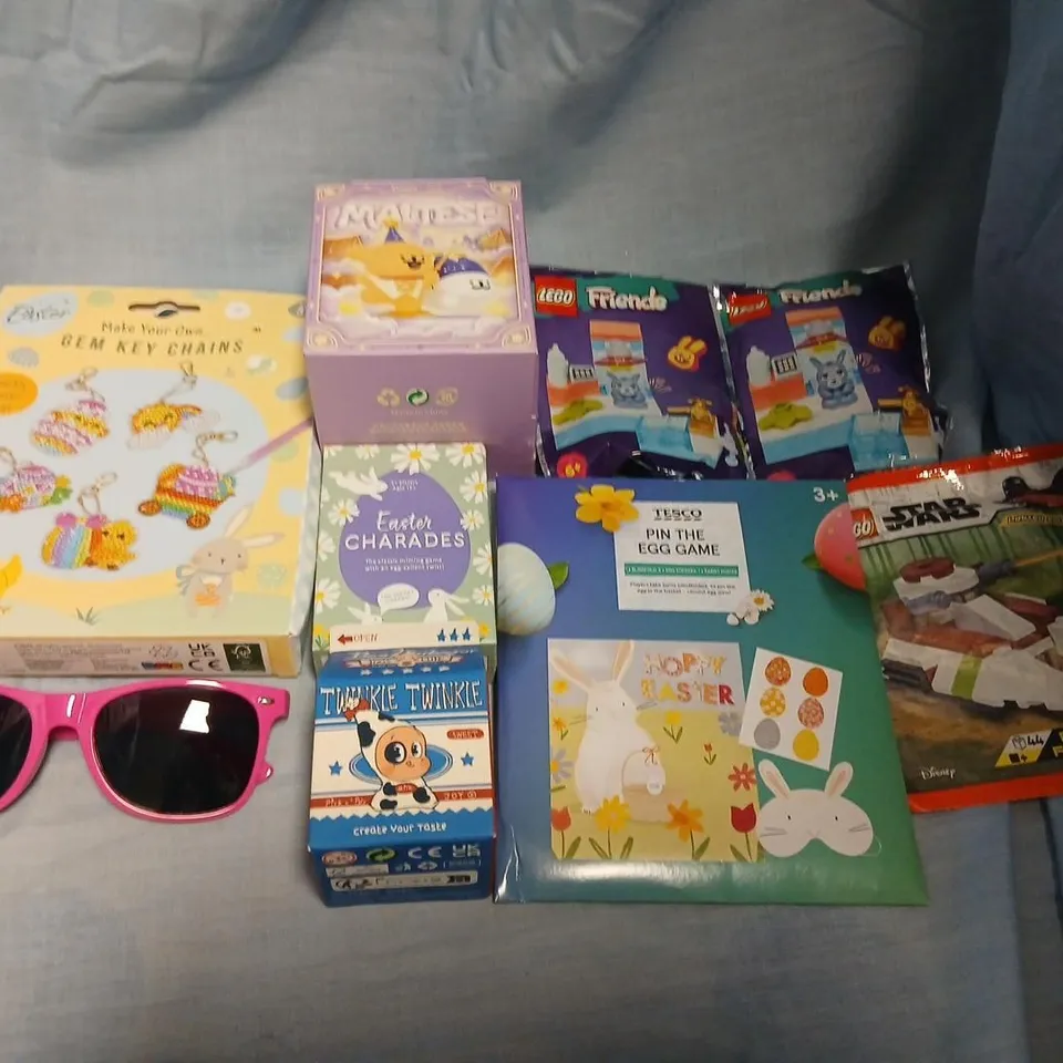LARGE QUANTITY OF ASSORTED TOYS AND ACCESSORIES TO INCLUDE; LEGO, MAKE YOUR OWN GEM KEYCHAINS, MALTESE, EASTER CHARADES AND PIN THE EGG GAME