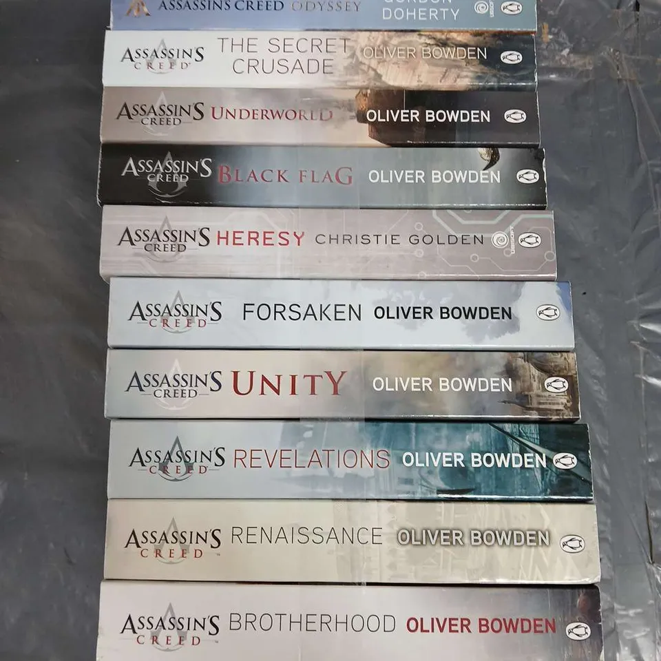 COLLECTION OF 10 ASSORTED ASSASSINS CREED BOOKS TO INCLUDE; ODYSSEY, THE SECRET CRUSADE, UNDERWORLD, BLACK FLAG AND UNITY