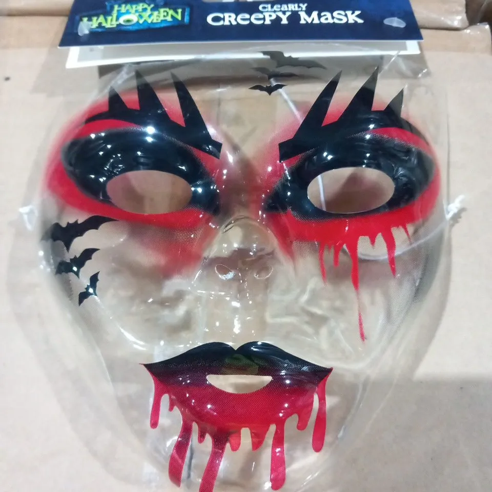 SIX BOXES OF 12 BRAND NEW CLEARLY CREEPY MASKS