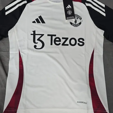 ADIDAS KID'S MANCHESTER UNITED TRAINING JERSEY IN OFF-WHITE/BLACK/RED SIZE 9-10 YEARS