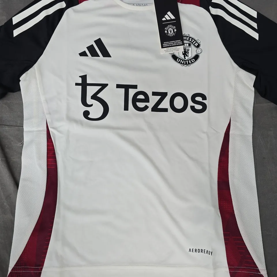 ADIDAS KID'S MANCHESTER UNITED TRAINING JERSEY IN OFF-WHITE/BLACK/RED SIZE 9-10 YEARS