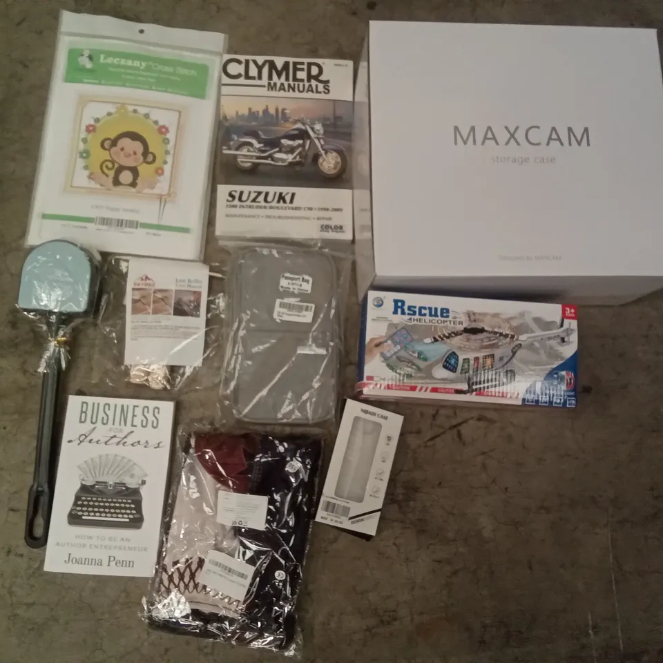 PALLET OF ASSORTED ITEMS INCLUDING MAXCAM STORAGE CASE, PASSPORT HOLDER, BUSINESS FOR AUTHORS BOOK, LINT ROLLERS, TOILET BRUSH, HARLEY QUINN COSPLAY COSTUME 