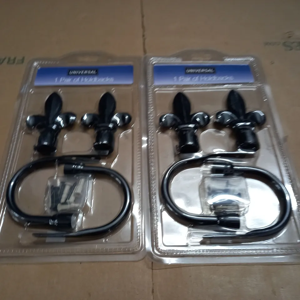 TWO PAIRS OF HOLDBACKS
