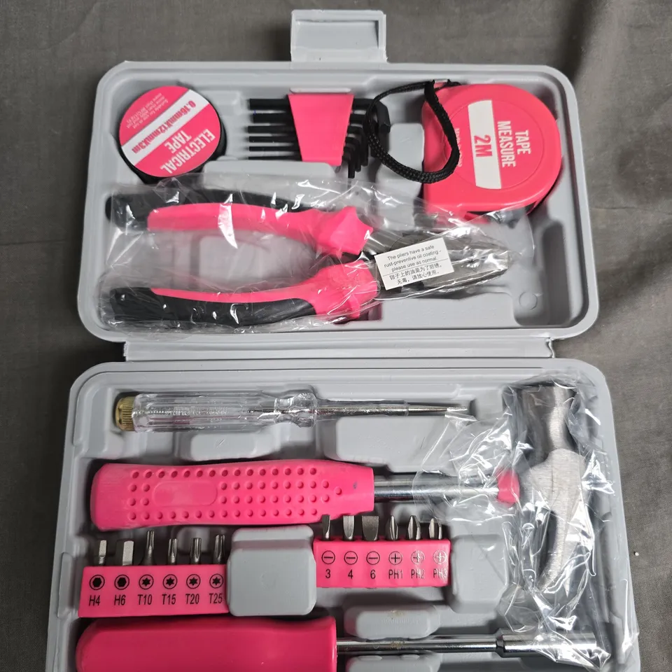 Pink-handled screwdriver set with bits in plastic case
