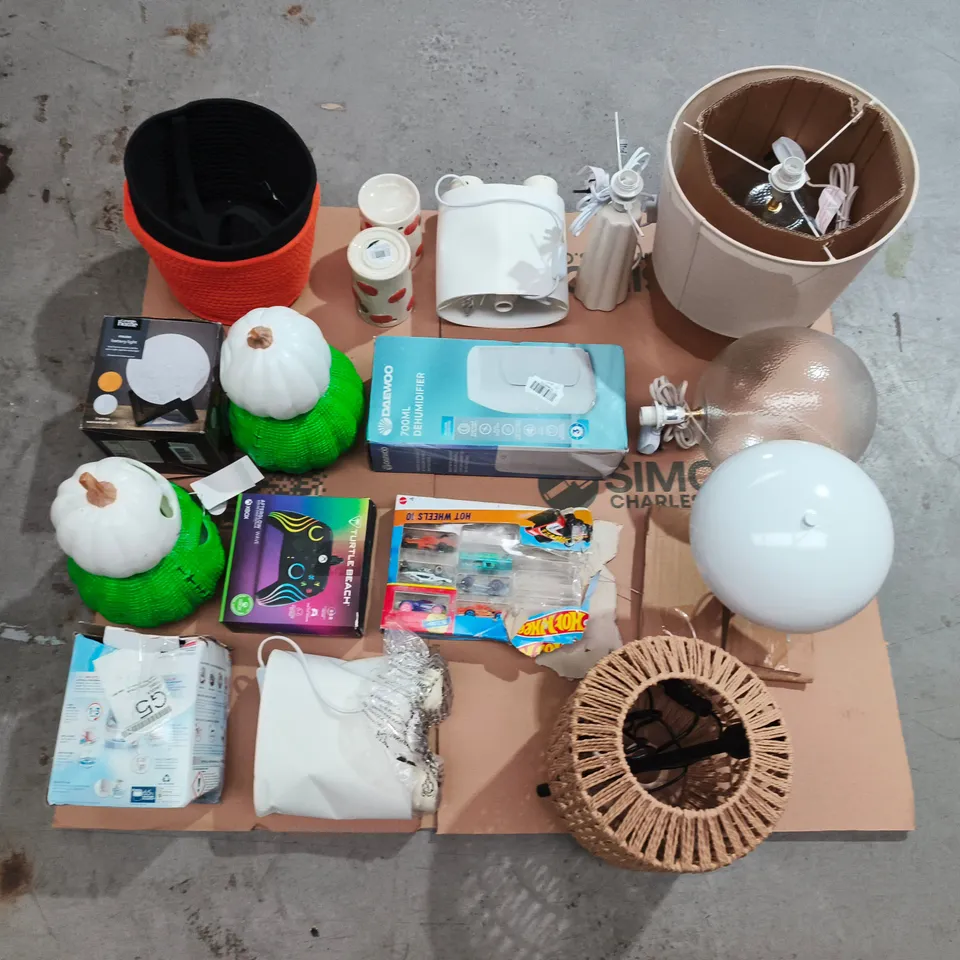 PALLET CONTAINING LARGE QUANTITY OF HOUSEHOLD ITEMS TOO INCLUDE DEHUMIDIFIER , DAMAGED LAMPS , HALLOWEEN ACCESSORIES , CONSOLE CONTROLLERS , ETC