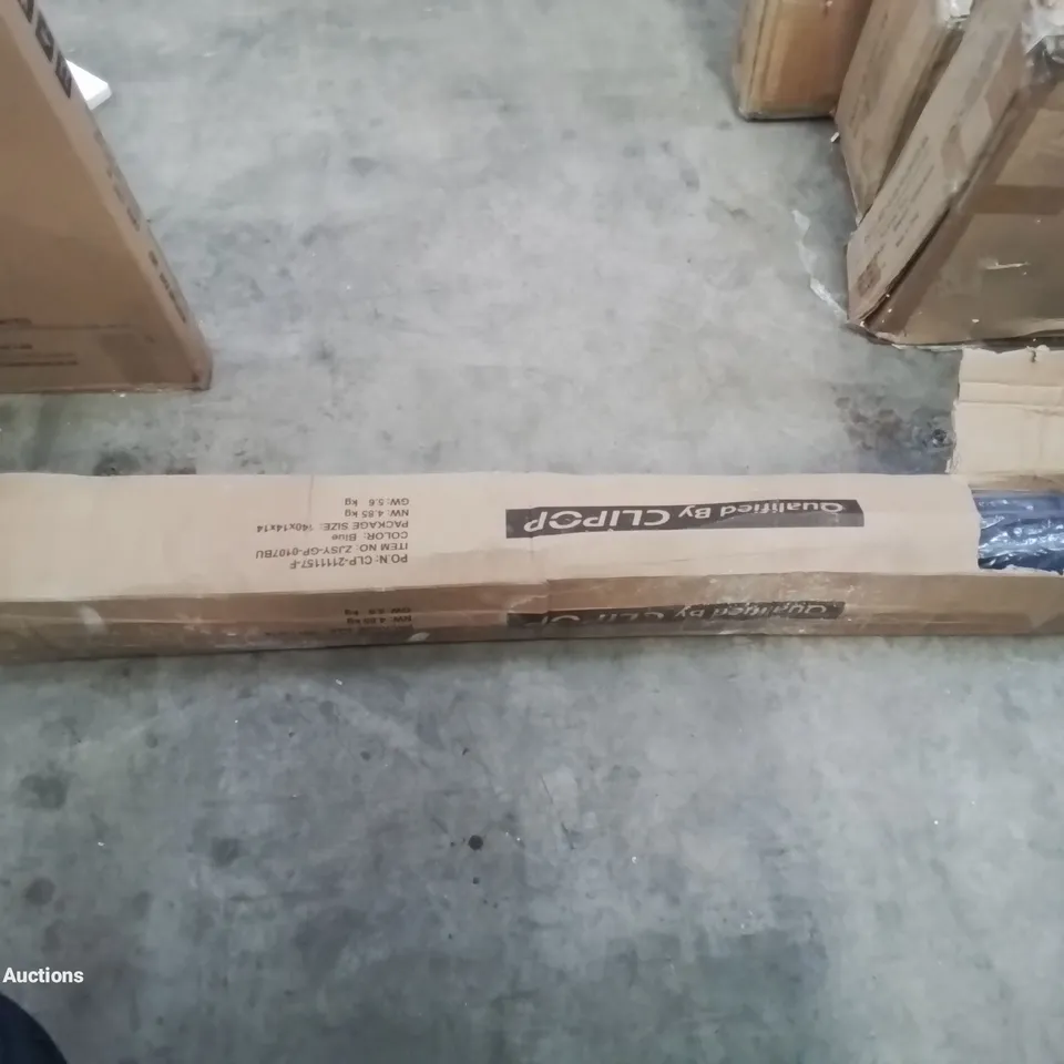 A BOXED BLUE PARASOL