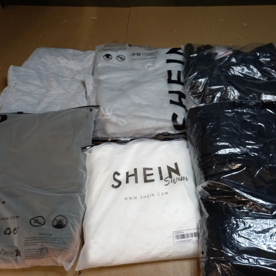 LARGE BOX OF ASSORTED CLOTHING ITEMS TOO INCLUDE TOPS , DRESSES AND PANTS ALL IN VARIOUS SIZES AND COLOURS 