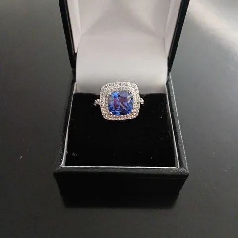 STERLING SILVER RHODIUM PLATED DQ TANZANITE HALO RING