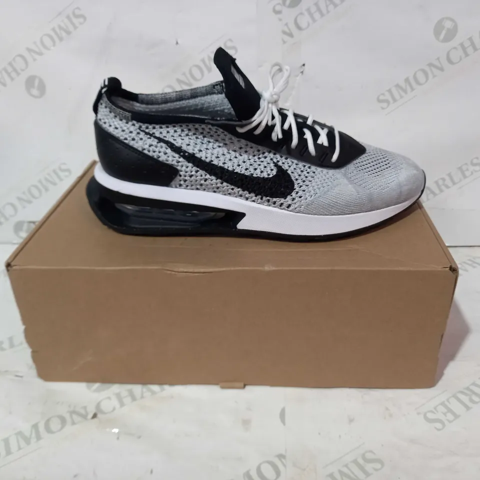 BOXED PAIR OF NIKE FLYKNIT SHOES IN WHITE/BLACK UK SIZE 7