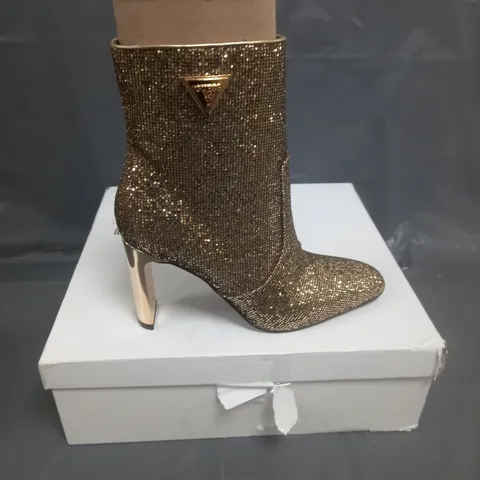 BOXED PAIR OF GUESS HEELED BOOTS IN GOLD SIZE 38