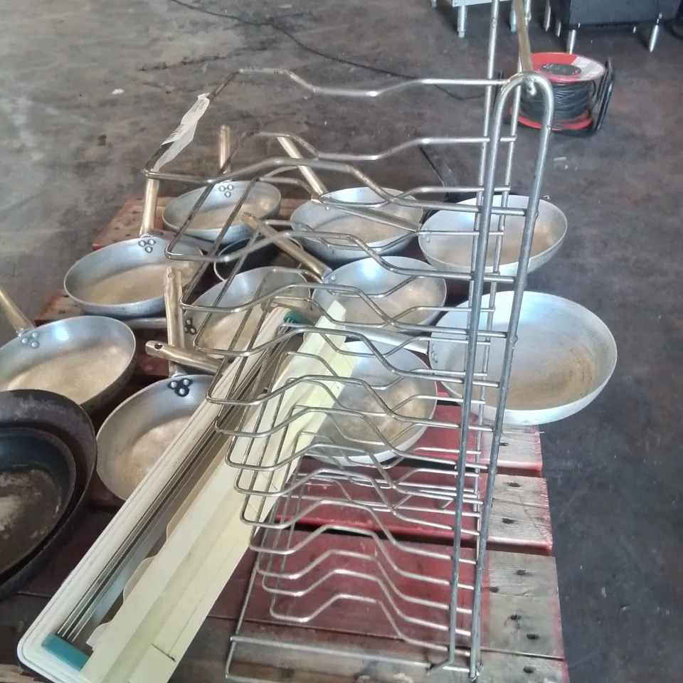 LARGE AMOUNT OF COMMERCIAL FRYING PANS AND STAINLESS STEEL PLATE RACK AND FOOD PACKAGING CUTTER