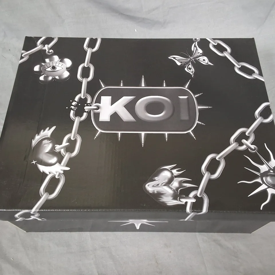 BOXED PAIR OF KOI BANE OF EXILE TRAINERS - UK 7