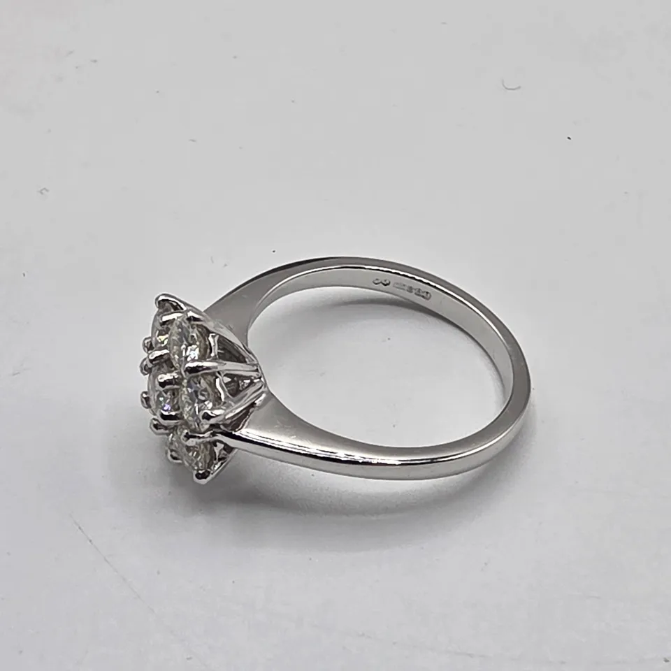 PLATINUM DAISY CLUSTER RING SET WITH NATURAL DIAMONDS WEIGHING +-1.06CT