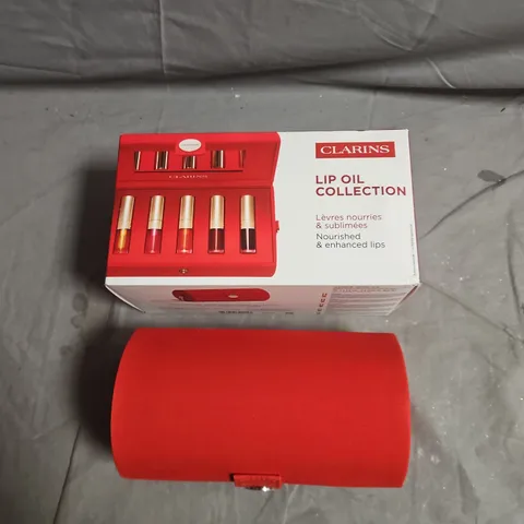 CLARINS LIP COMFORT OIL COLLECTION SET – 5 LIP OILS IN RED CASE