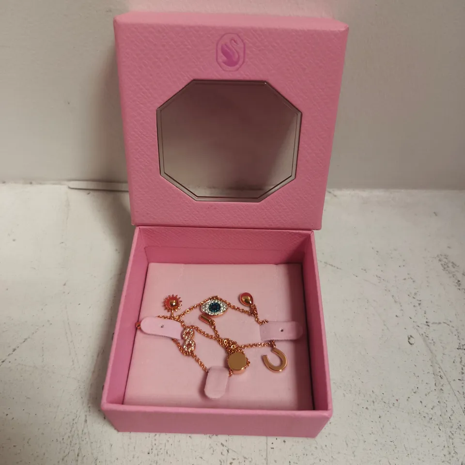 BOXED SWAROVSKI SYMBOLIC ROSE-GOLD EVIL EYE CHARM BRACELET
