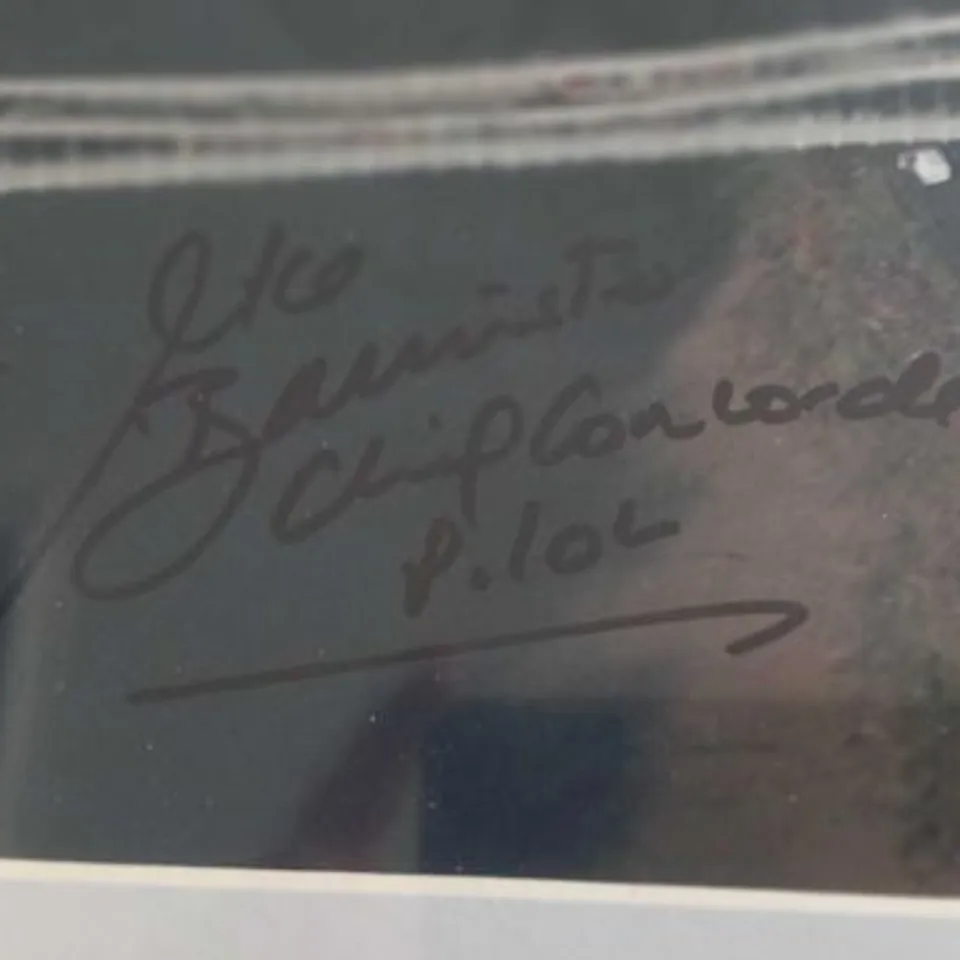 FRAMED AND MOUNTED PHOTOGRAPH OF  THE CONCORDE ON ITS LAST-EVER FLIGHT, OVER THE CLIFTON SUSPENSION BRIDGE IN BRISTOL, WESTERN ENGLAND BY LEWIS WHYLD SIGNED BY CHIEF PILOT CAPTAIN MIKE BANNISTER