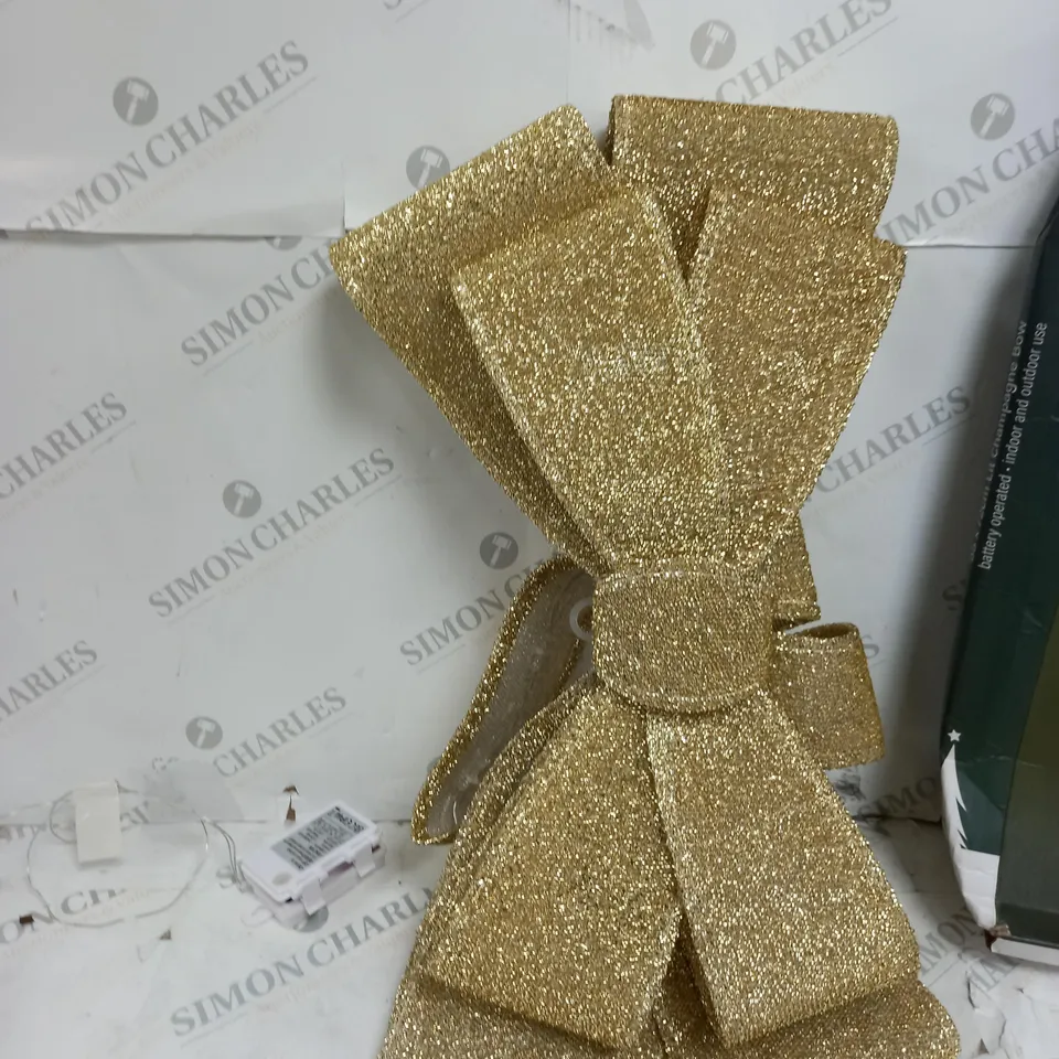 FESTIVE 55 X 72CM LIT CHAMPAGNE BOW 