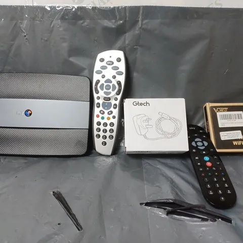 BOX OF APPROXIMATELY 12 ASSORTED ITEMS TO INCLUDE - GTECH PLUG , SKY REMOTE , BT SMART HUB ETC