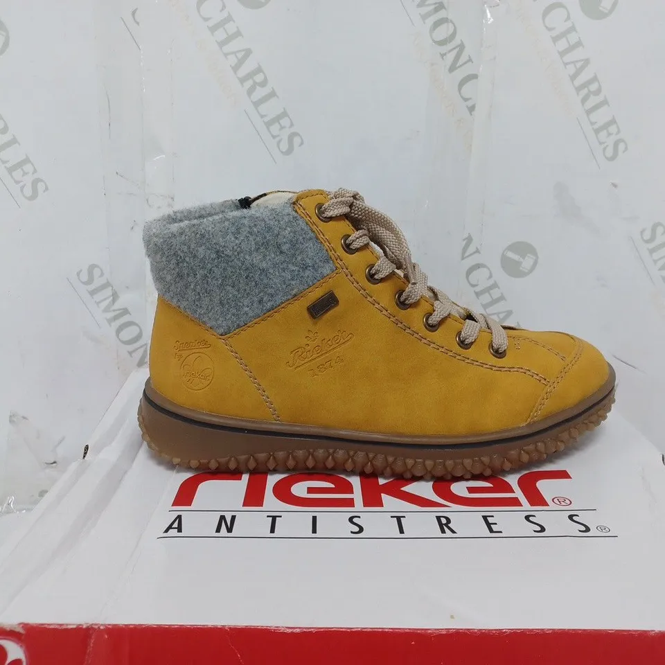 BOXED PAIR OF RIEKER LACE UP WATER RESISTANT BOOTS IN YELLOW SIZE 4