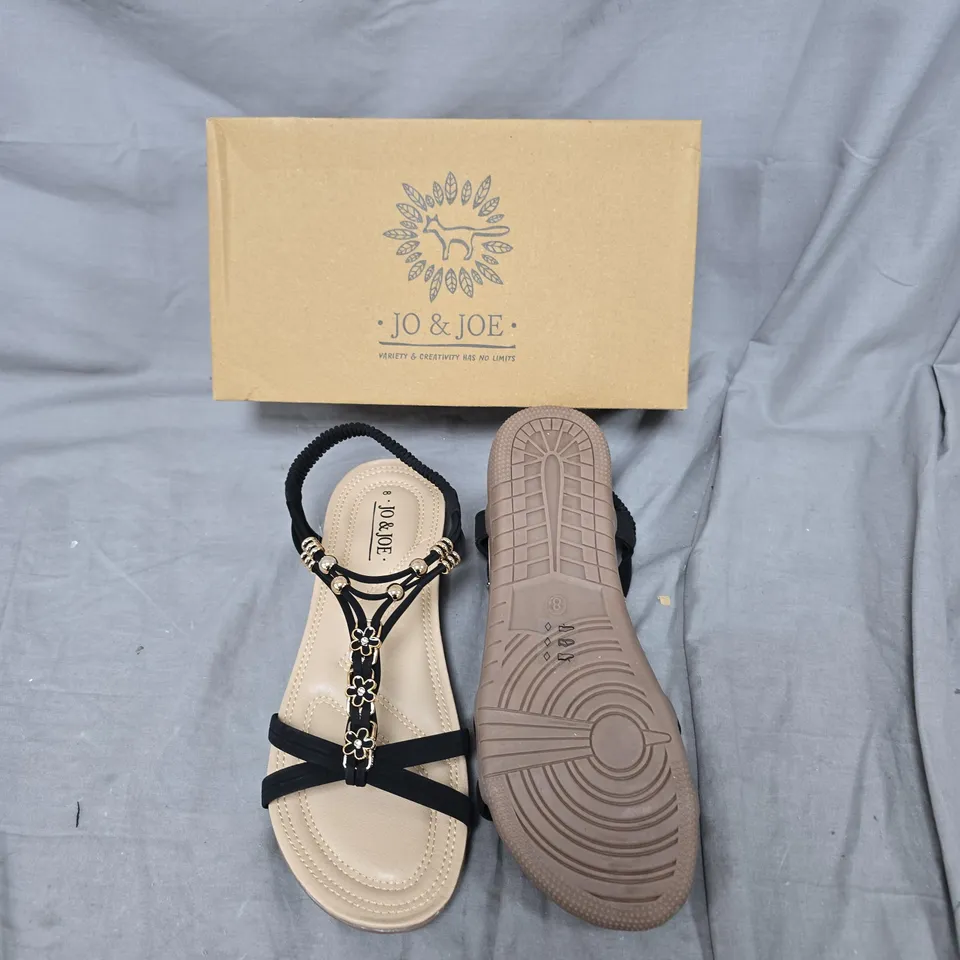 JO & JOE WOMEN’S SANDALS – BLACK STRAPS WITH FLORAL EMBELLISHMENTS – UK 8