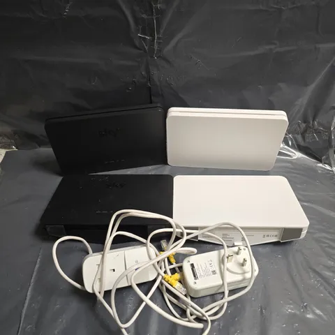 APPROXIMATELY 6 ASSORTED ELECTRICAL PRODUCTS TO INCLUDE - SKY ROUTER - BT MINI CONNECTOR