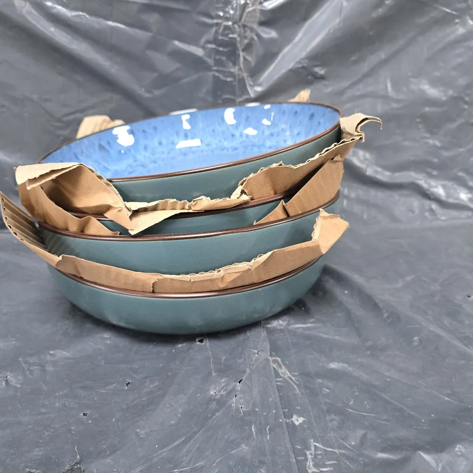 4 glazed serving bowls in blue