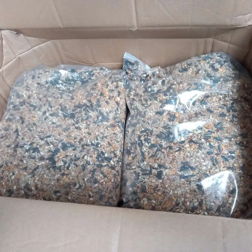 FOUR LARGE BAGS OF BIRD SEED