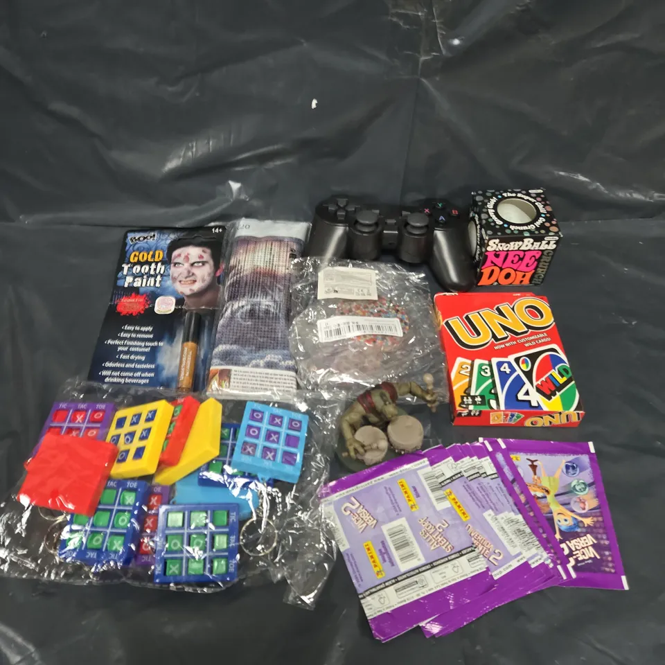 APPROXIMATELY 15 ASSORTED TOY AND GAMES TO INCLUDE UNO, GAME CONTROLLERS AND STICKERS