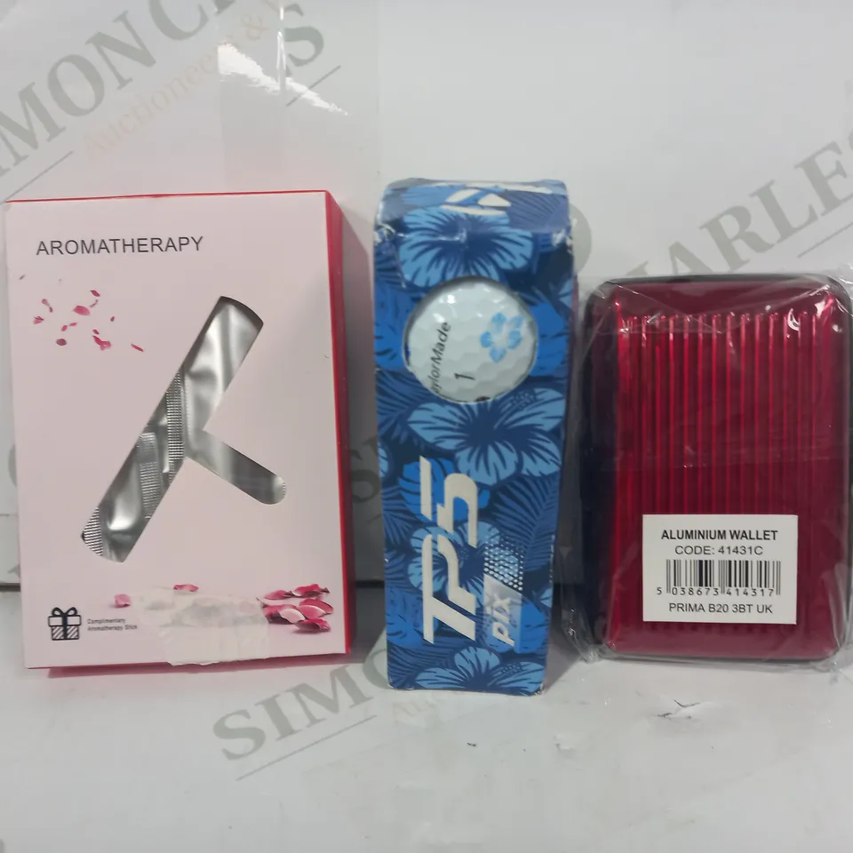 LOT OF APPROXIMATELY 10 ASSORTED HOUSEHOLD ITEMS TO INCLUDE ALUMINIUM WALLET IN RED, TAYLORMADE TP5 GOLF BALLS, ETC