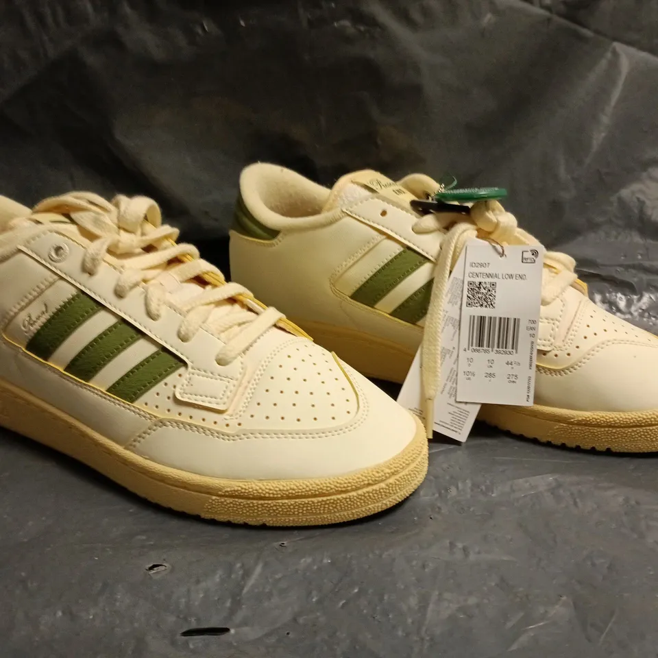 PAIR OF ADIDAS CENTENNIAL LOW END TRAINERS IN CREAM/GREEN SIZE UK 10