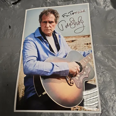 SET OF 4 AUTOGRAPHED ROCK PHOTOGRAPHS (SIGNED BY MARK KNOPFLER)