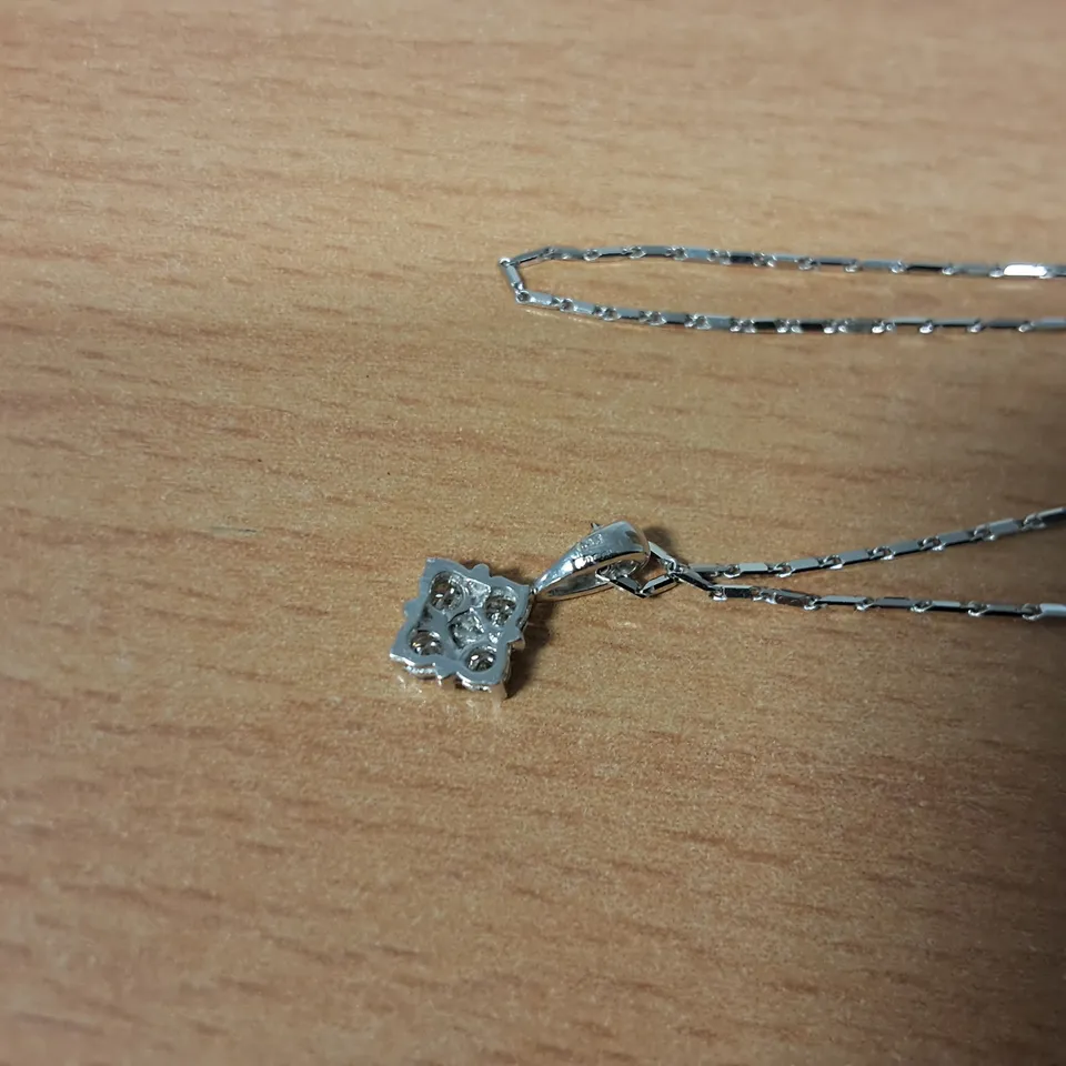 18CT WHITE GOLD SALTIRE PENDANT ON CHAIN SET WITH NATURAL DIAMONDS