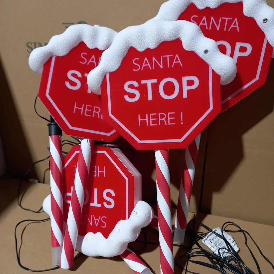 FESTIVE SET OF PRELIT SANTA STOP HERE STAKES