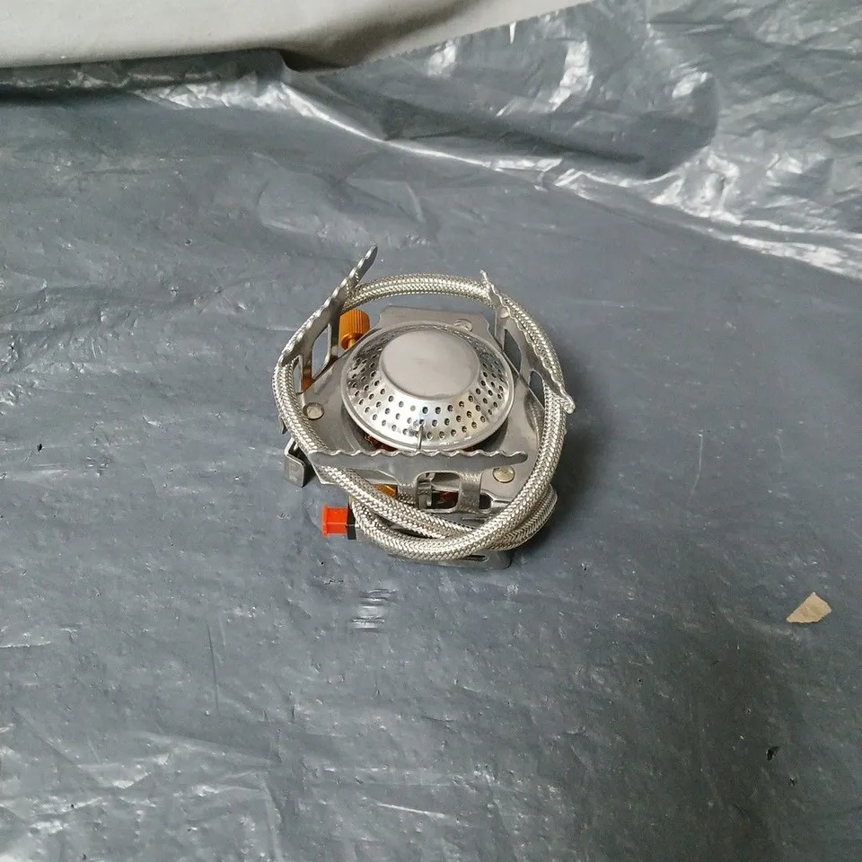 COMPACT, FOLDABLE CAMPING STOVE BURNER IN ORANGE BOX