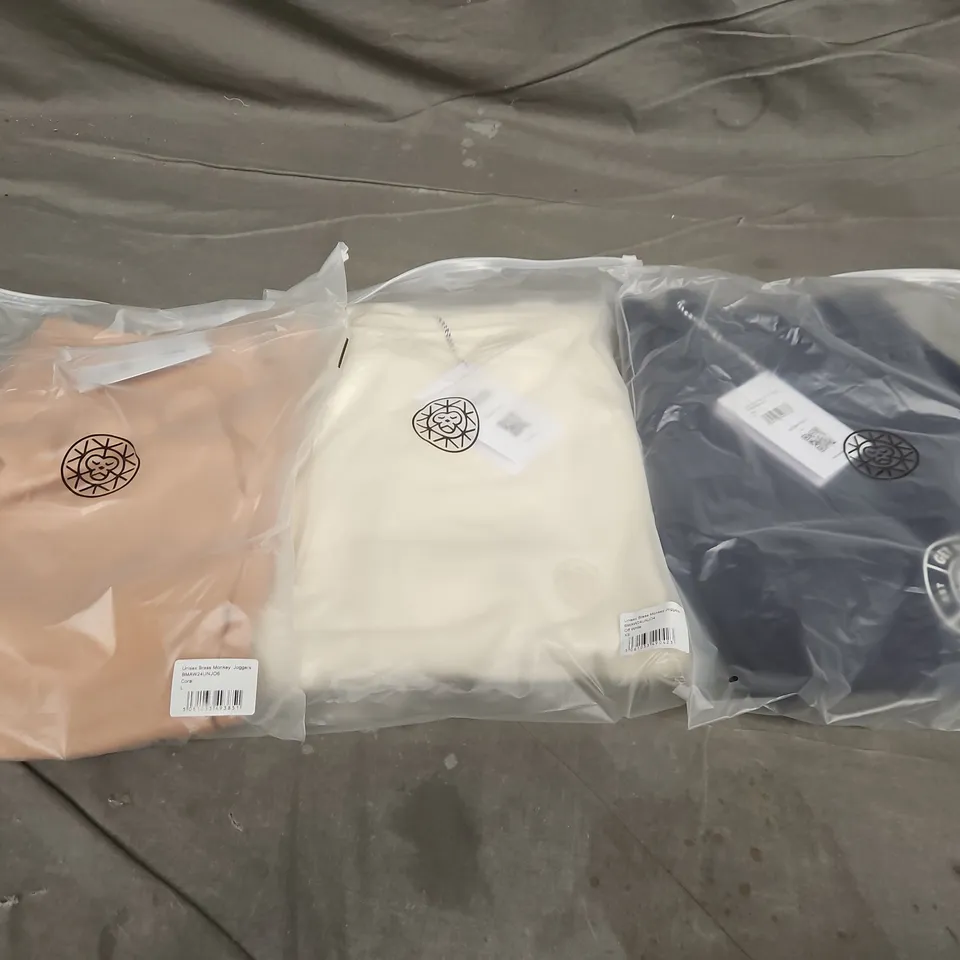 APPROXIMATELY 20 ASSORTED BAGGED CLOTHING ITEMS IN VARIOUS SIZES, STYLES & COLOURS TO INCLUDE UNISEX GET YOUR COLD ON JOGGERS & UNISEX BRASS MONKEY JOGGERS, ETC