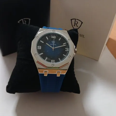 RUCKSTUHL WRISTWATCH – STAINLESS STEEL OCTAGONAL BEZEL, BLUE STRAP (BOXED)