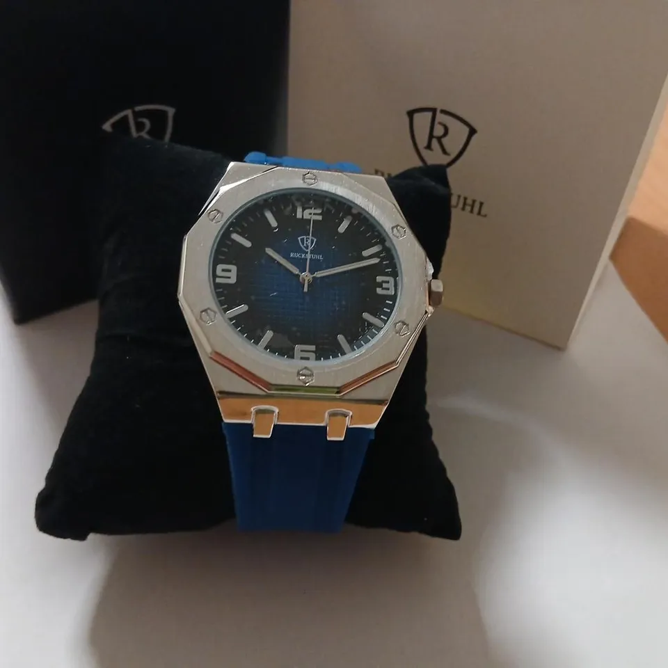 RUCKSTUHL WRISTWATCH – STAINLESS STEEL OCTAGONAL BEZEL, BLUE STRAP (BOXED)